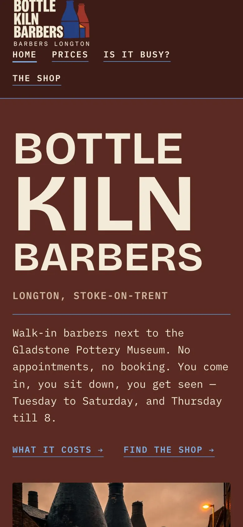 Bottle Kiln Barbers' home page on a phone: the name in huge cream capitals on oxblood, beside a photograph of the bottle kilns at dusk